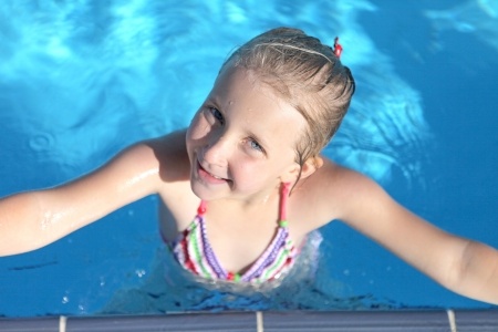 young-girl-swimming-in-pool.jpg
