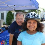 Attorney David White with a young cyclist in South Boston.