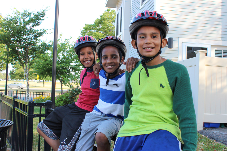 Boys wearing bicycle helmets at Tierney Center in South Boston