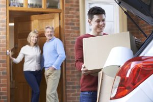 College student and moving box