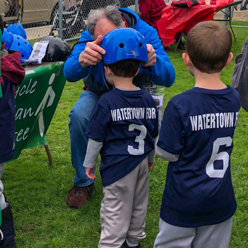 Watertown Little League Bike Helmet Giveaway. Helmets donated by Breakstone, White & Gluck.