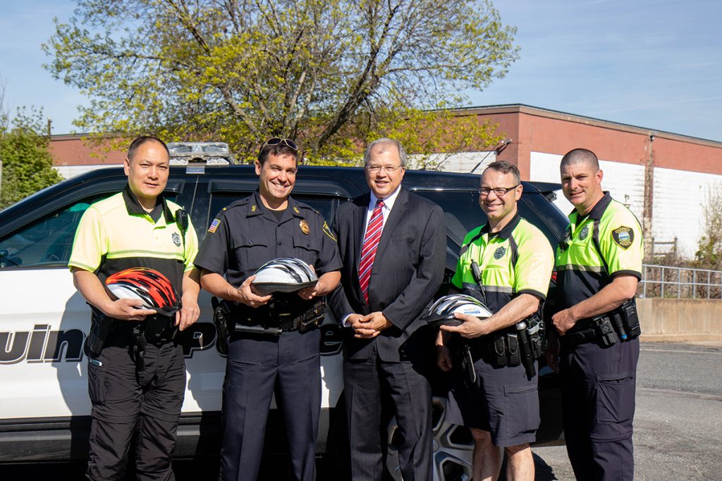 Quincy police officers with Attorney David W. White of Breakstone, White & Gluck