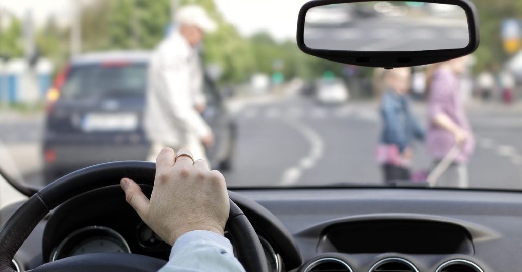 Driver and an older pedestrian at a Massachusetts crosswalk