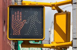In Massachusetts, the risk of pedestrian accidents can be reduced with safety infrastructure, such as pedestrian traffic signals.