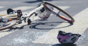 Damaged bike and helmet after a bicycle crash in Boston