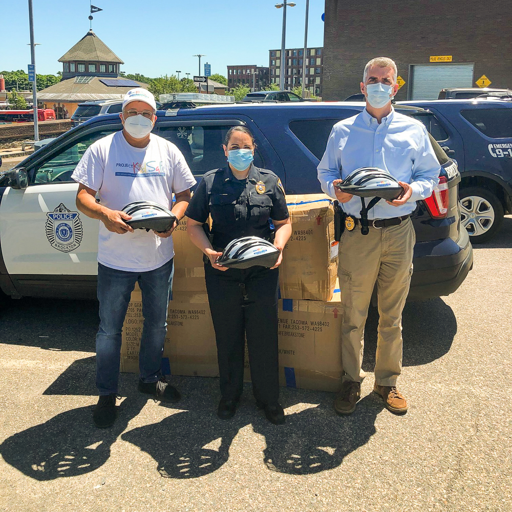Boston Attorney David W. White of Breakstone, White & Gluck donates children's bicycle helmets to Brockton Police, as part of Project KidSafe campaign.