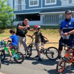 Everett Police giving away free bicycle helmets to local children from Breakstone, White & Gluck's Project KidSafe campaign