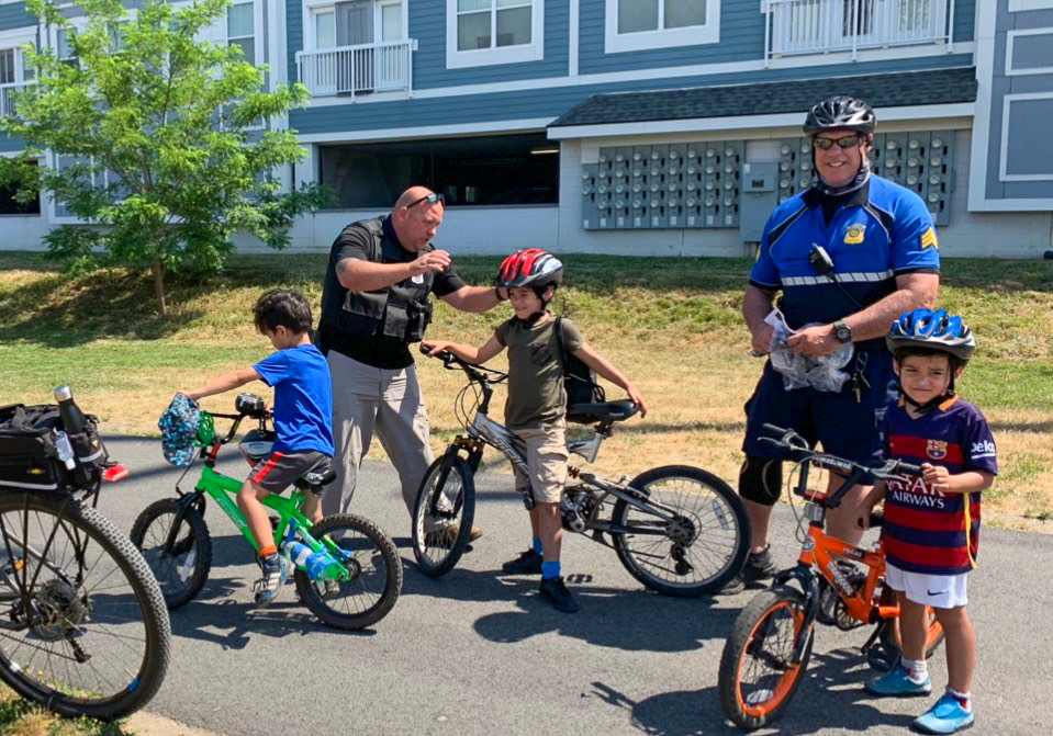 Everett Police giving away free bicycle helmets to local children from Breakstone, White & Gluck's Project KidSafe campaign