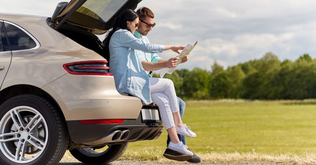 Couple planning for summer road trip in Massachusetts.