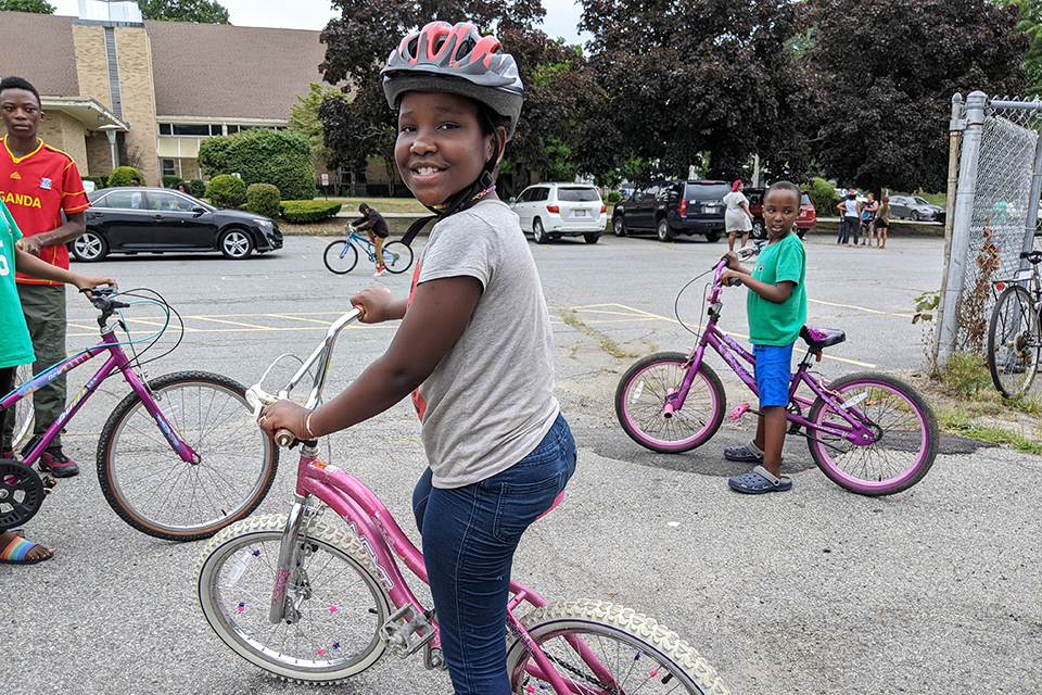 Cyclist receives free helmet from Boston law firm Project KidSafe