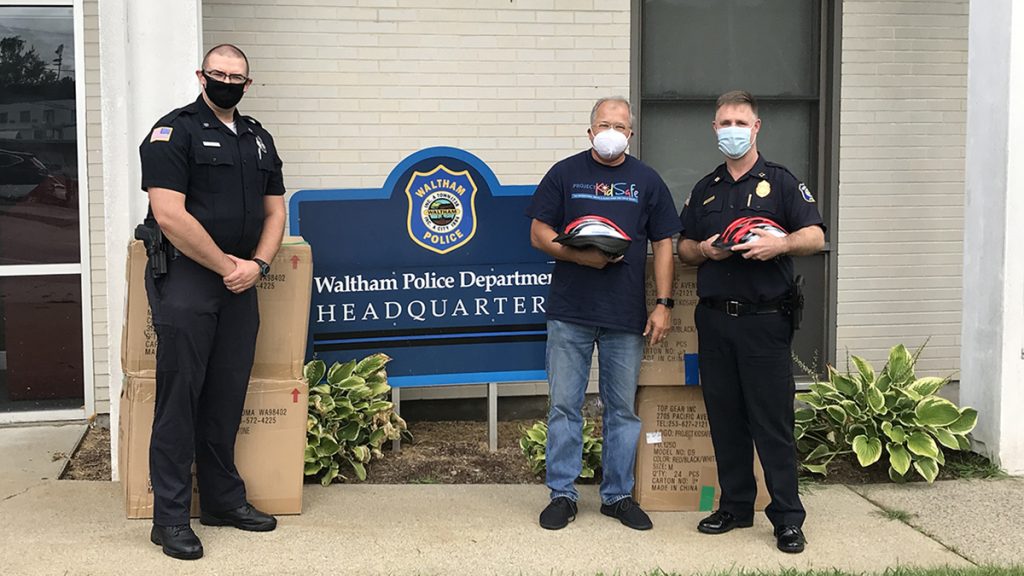 Attorney David W. White of Breakstone, White & Gluck of Boston at the Waltham Police Department Donating Children's Bike Helmets