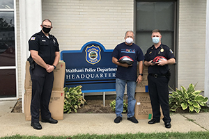 Attorney David W. White of Breakstone, White & Gluck of Boston at the Waltham Police Department Donating Children's Bike Helmets