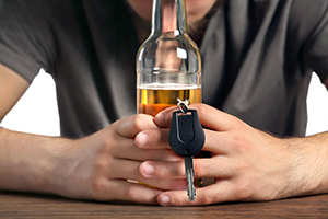 Teen considering drinking and driving, a leading cause of teen car accidents.