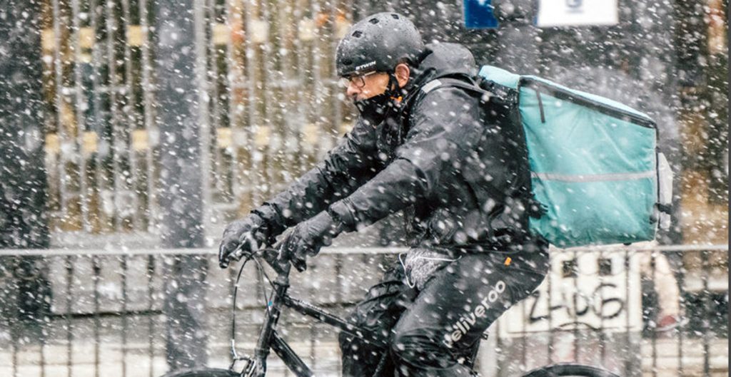 Boston cyclist riding in snow