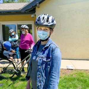 Girl wearing Project KidSafe bicycle helmet donated by Breakstone, White & Gluck.