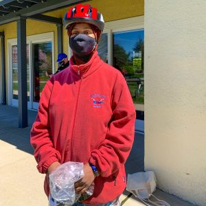 Cyclist wearing Project KidSafe bicycle helmet donated by Breakstone, White & Gluck at the Basic Bike Maintenance Class at Dedham Public Library.