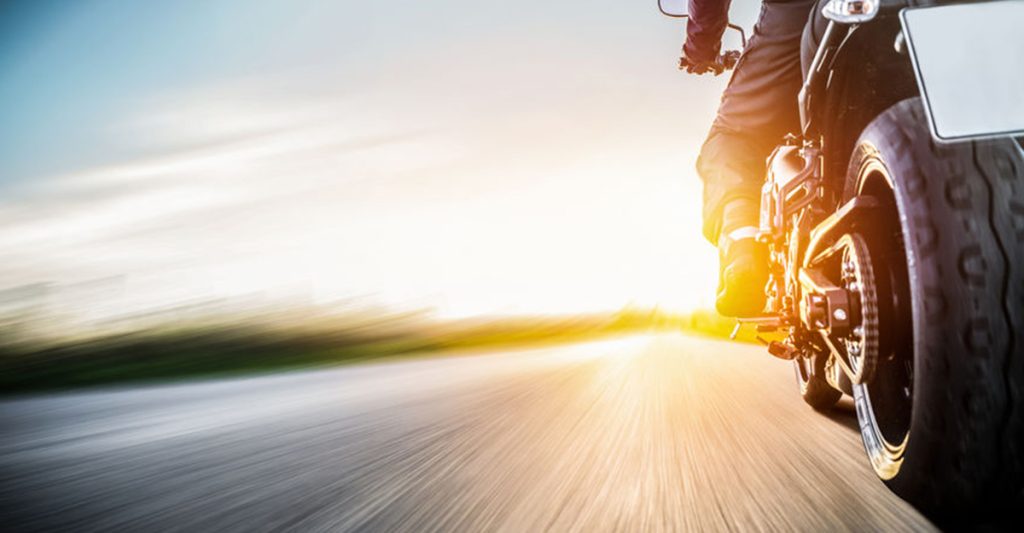 Motorcycle riding down open road