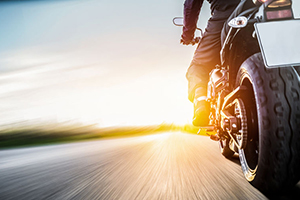 Motorcyclist riding down open road
