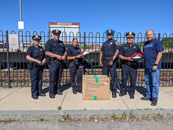 Brockton Police officers receive bicycle helmet donation from Boston lawyers of Breakstone, White & Gluck