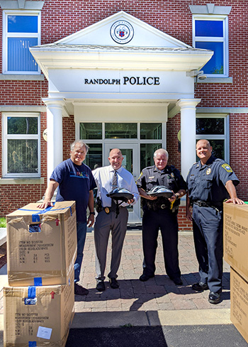 Randolph Police receive children's bicycle helmet donation from Breakstone, White & Gluck, a Boston law firm
