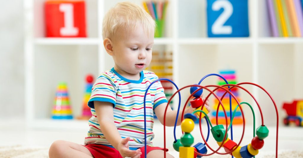 Child playing with holiday toys