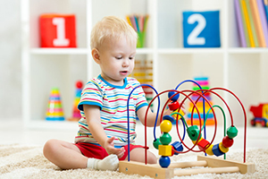 Child playing with safe toy