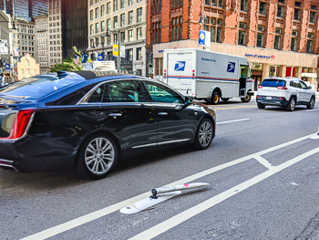 Boston bicycle lane with broken flexipost on Cambridge Street