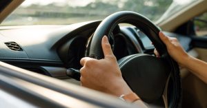 Massachusetts driver gripping the steering wheel