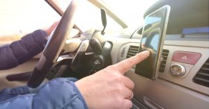 Driving using a cell phone mounted to a vehicle dashboard